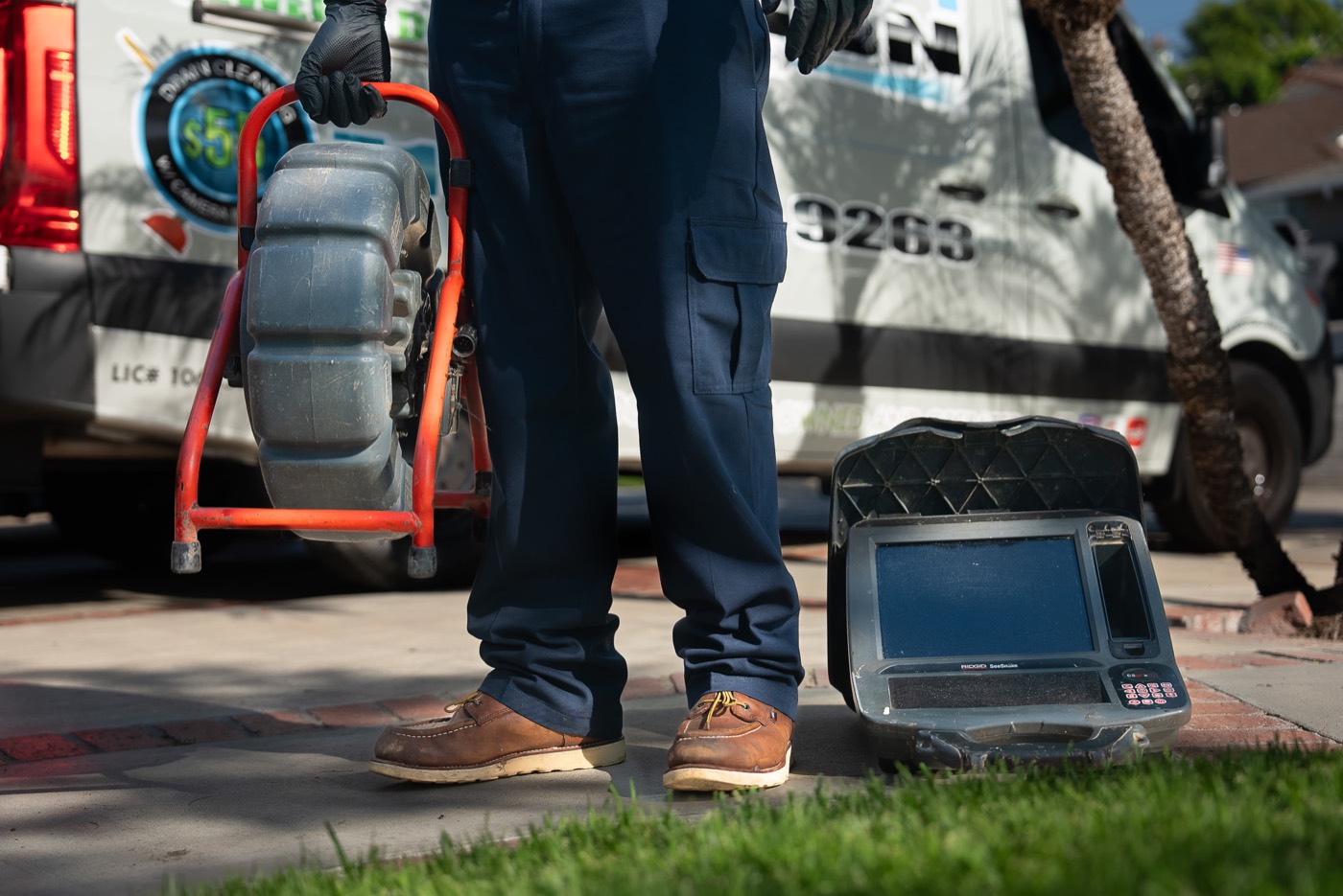 Sewer camera and monitor set up on a front lawn
