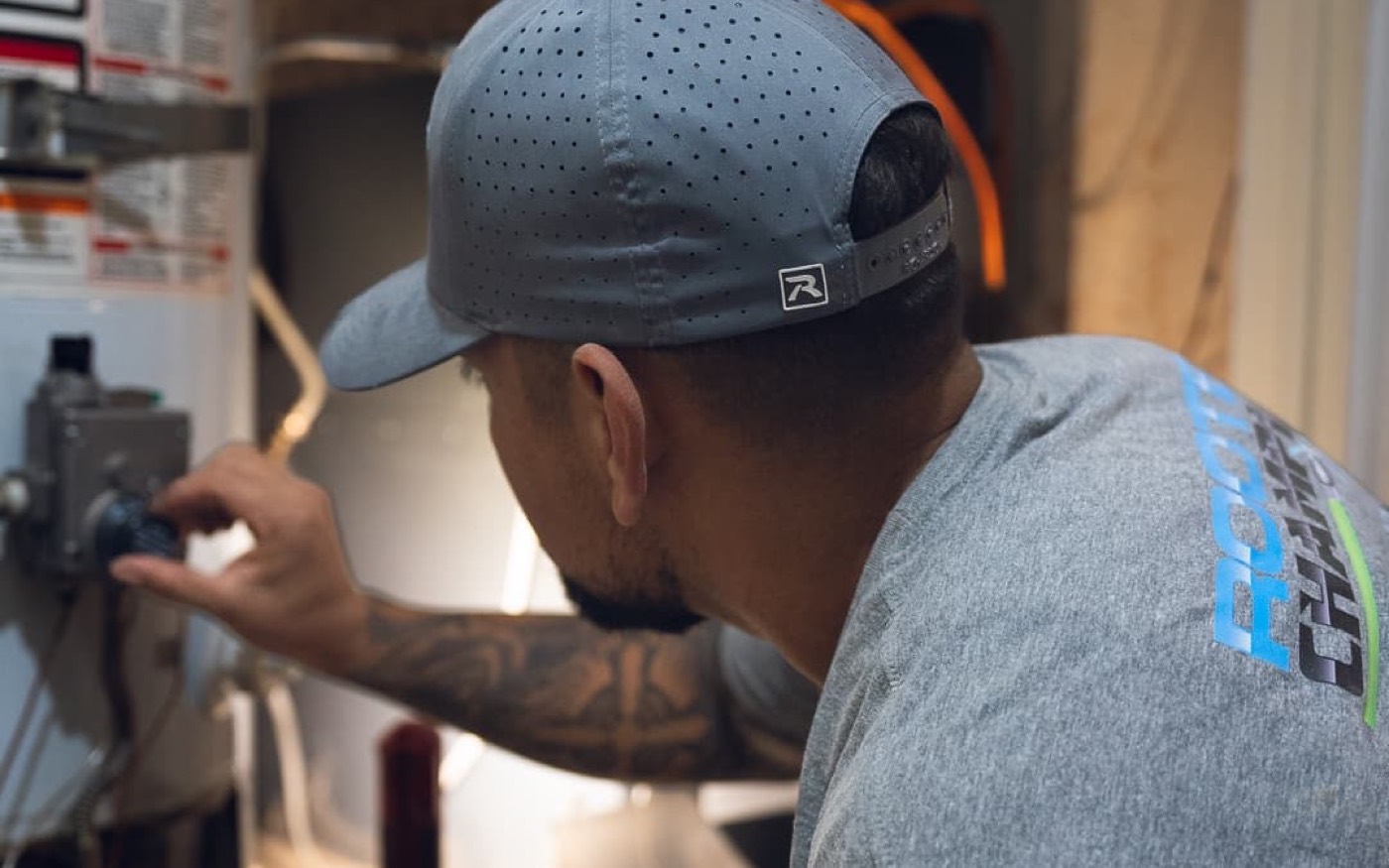 Technician working on a water heater